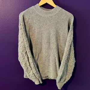 Loose fit, cozy sweater with polka dot detail